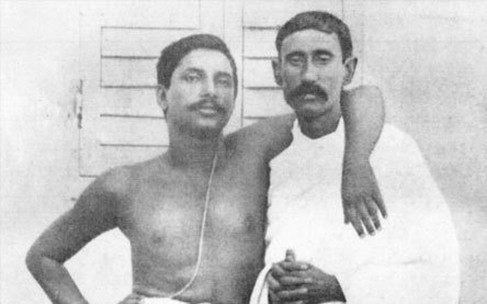Young Thakur with his arm around the shoulders of his friend Ananta Nath Roy